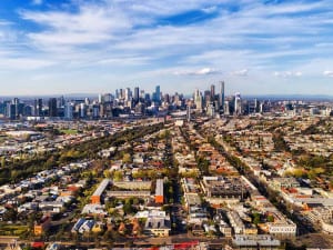 What the housing market holds for the future of private lending; picture of suburbs and city